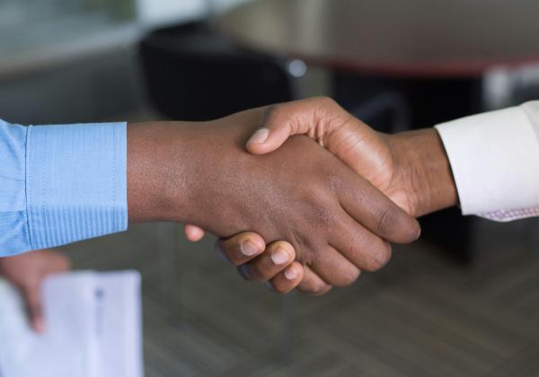 Two people shaking hands