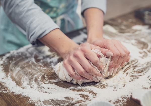 Hands kneading dough