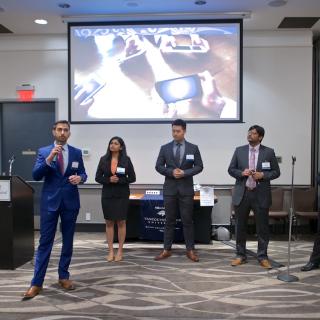 MBA internship students presenting their PechaKucha at the 2019 Business Mixer at the Coast Bastion Hotel