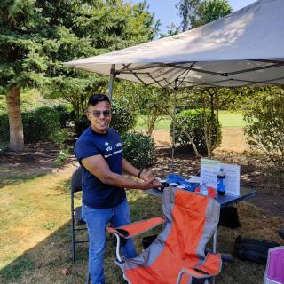 Tony Prem at the Volunteer Tent at the Chamber of Commerce Golf Tournament